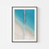Shallow waves splitting and rippling - framed coastal seascape art print in black frame