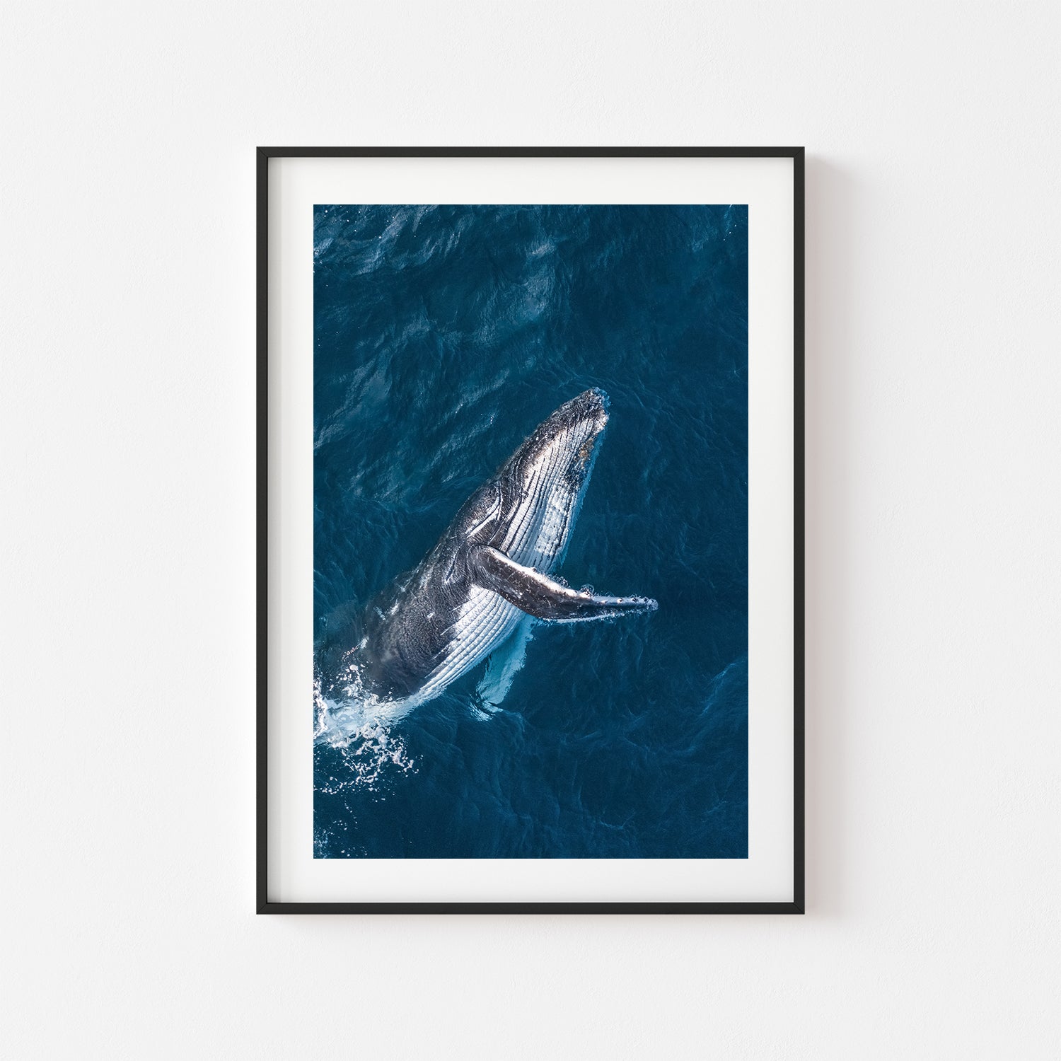 Bondi swimmers playing in ocean waves - framed beach photography wall art in black frame