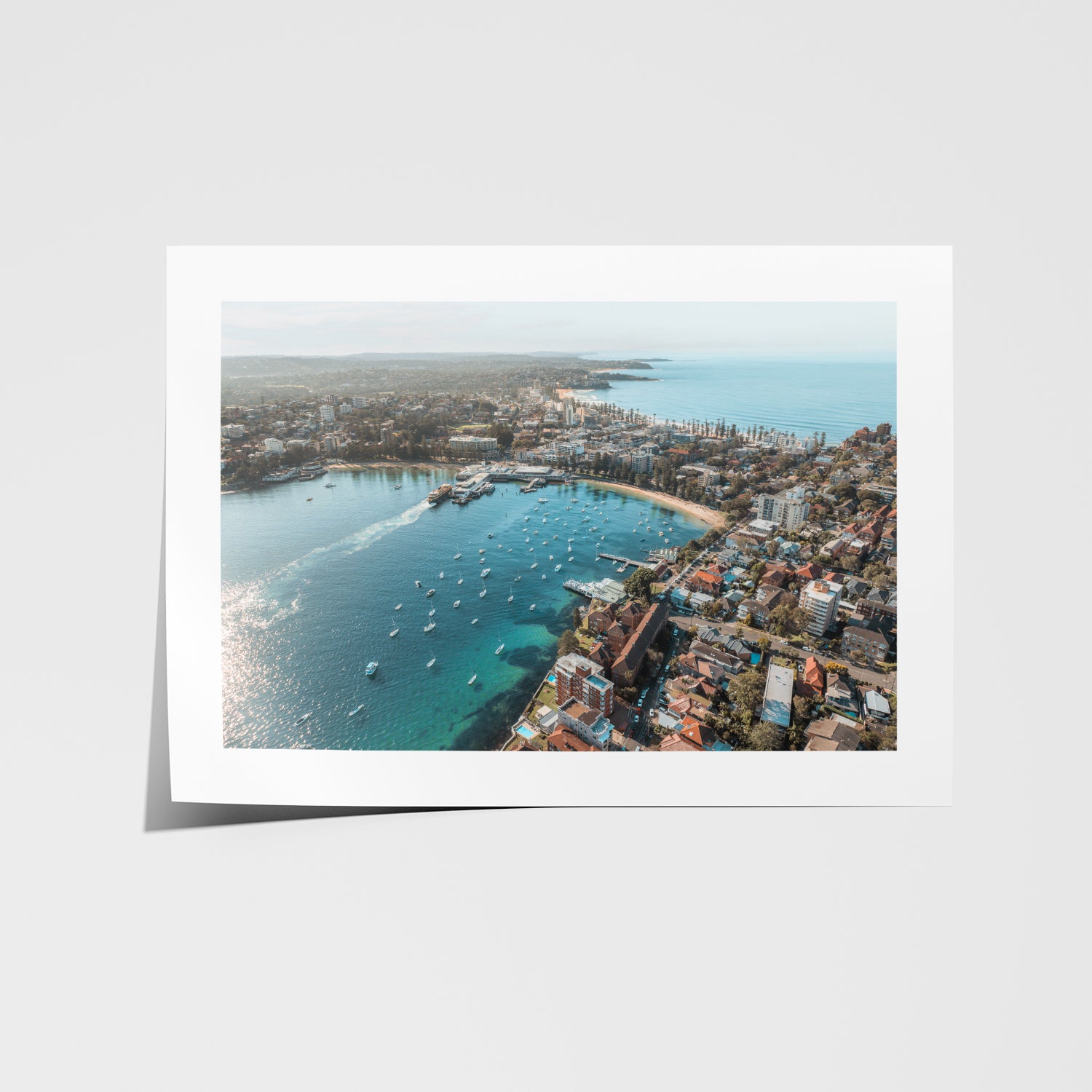 East Manly aerial view in white frame - coastal beach photography wall art