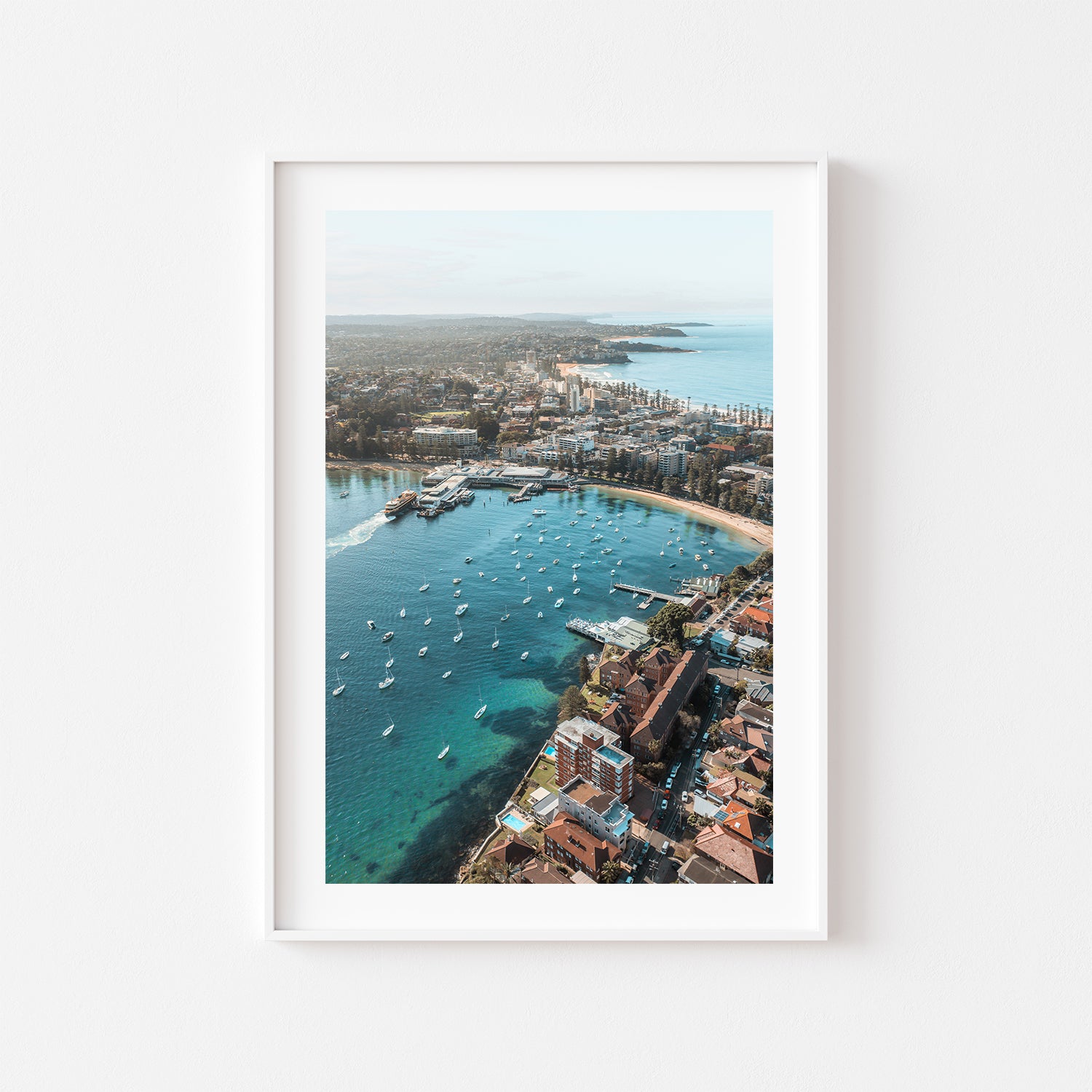 East Manly aerial view in white frame - coastal photography wall art for modern homes