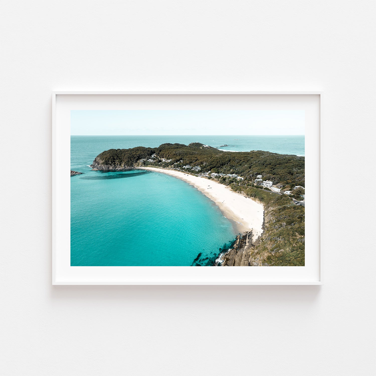 Coastal boat and beach landscape in white frame - nautical wall art for coastal homes