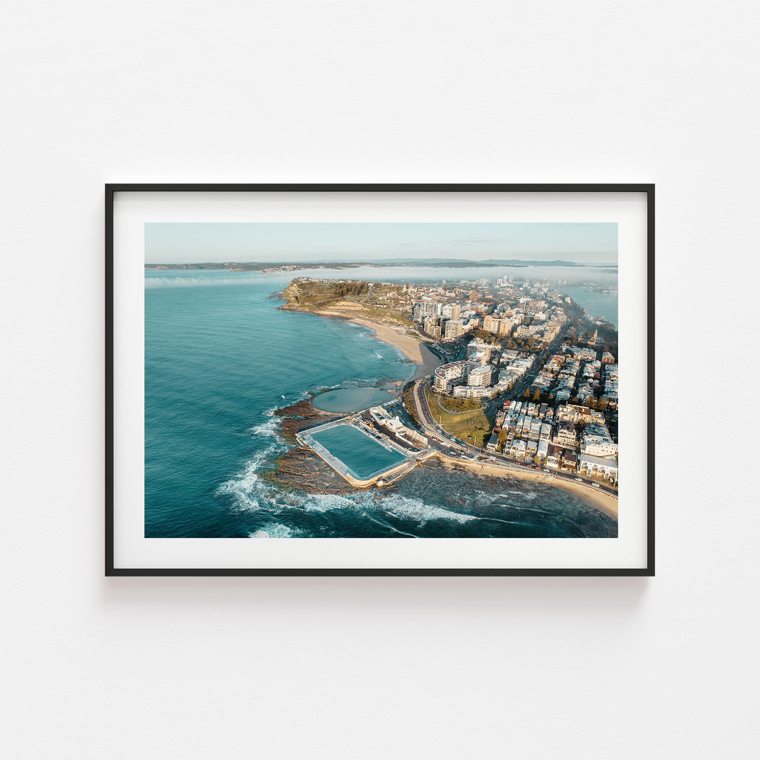 Newcastle cityscape shrouded in morning fog - black framed coastal wall art