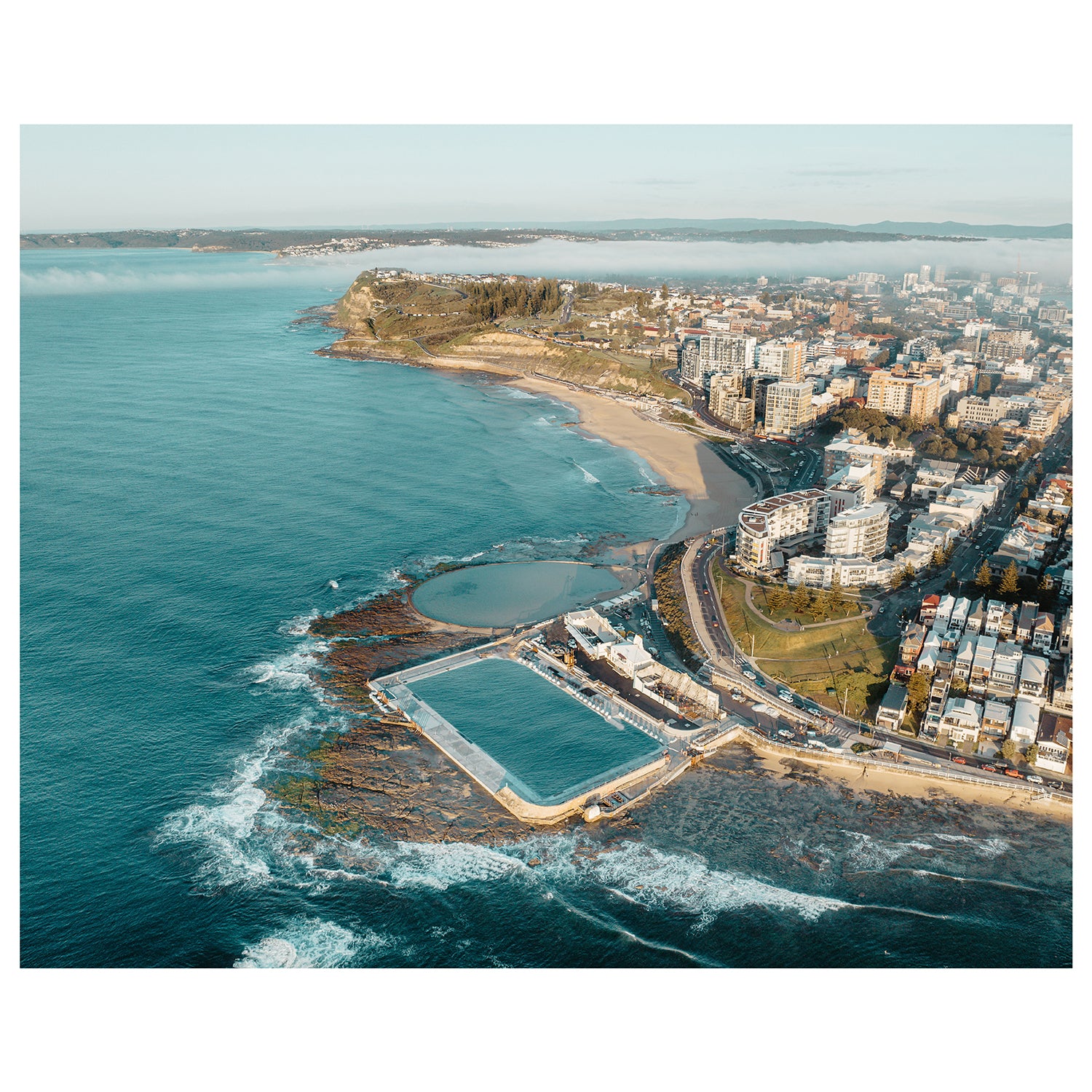 Newcastle cityscape shrouded in morning fog - moody landscape photography wall art