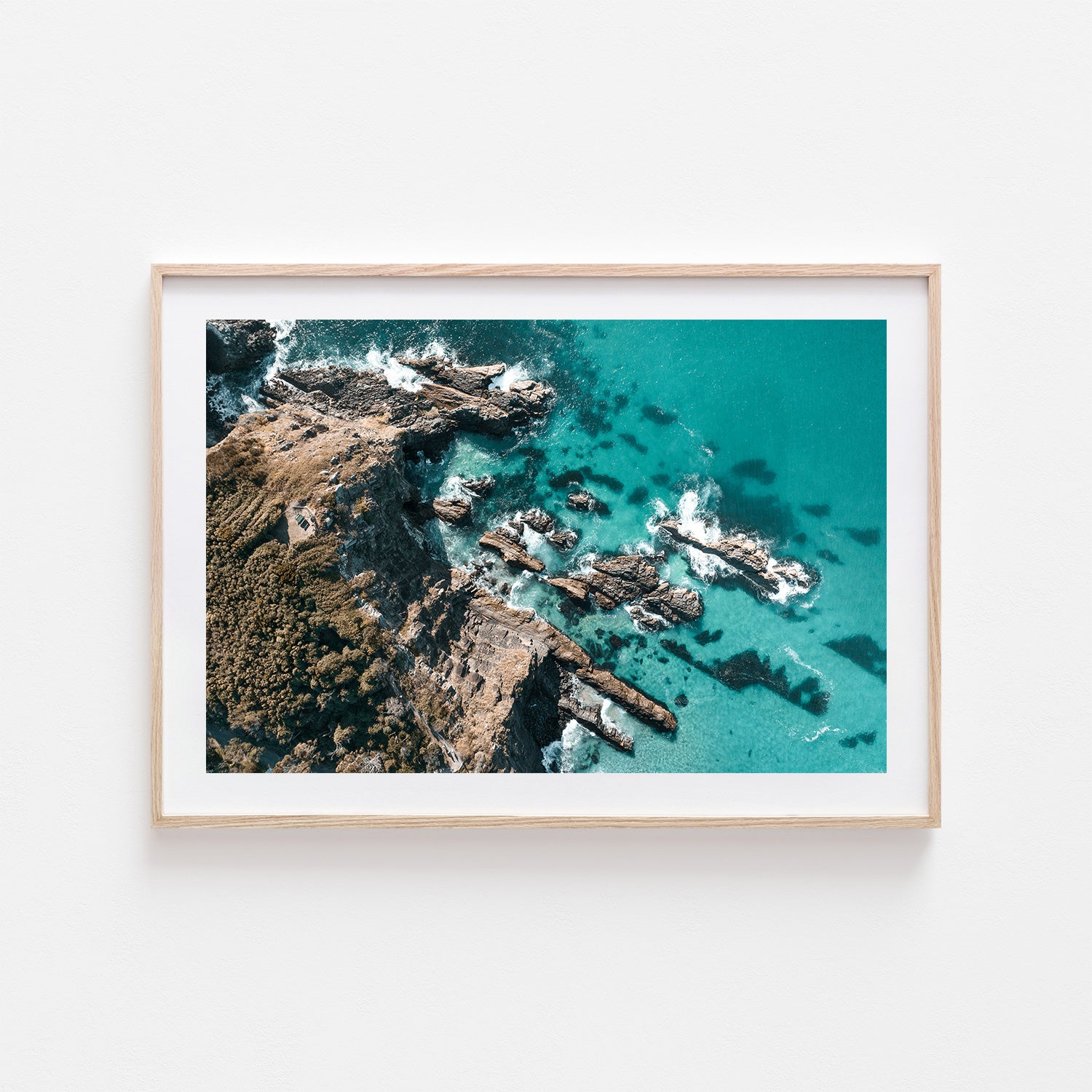 Forster cliffside seascape in oak frame - coastal landscape wall art for modern homes