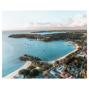 Balmoral Beach swimming spot glowing at sunset - unframed coastal photography wall art