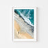 Incoming waves crashing on rocky shore in white frame - dramatic seascape wall art for