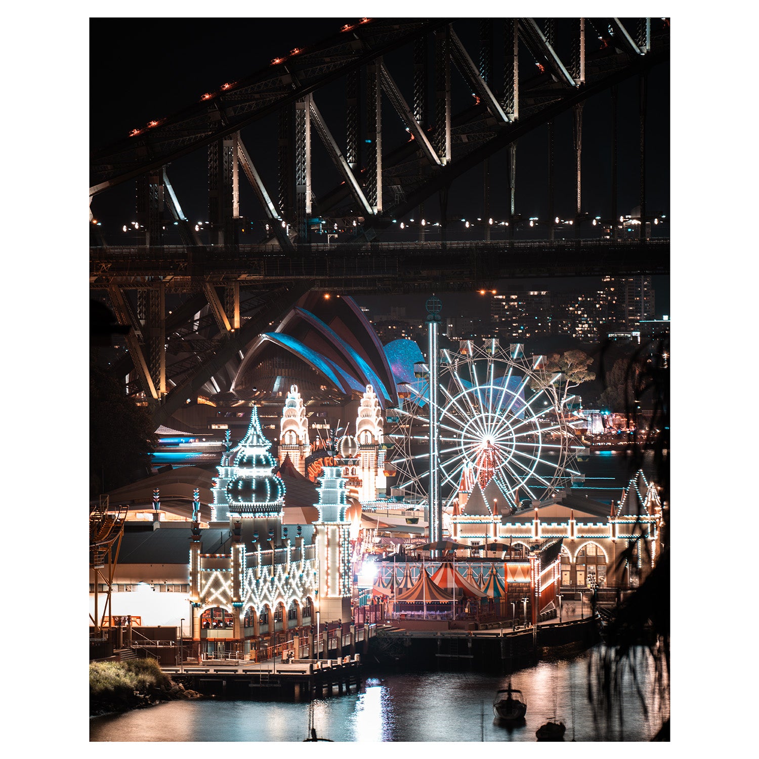 Luna Park Sydney's glowing carnival lights at night - unframed coastal photography wall