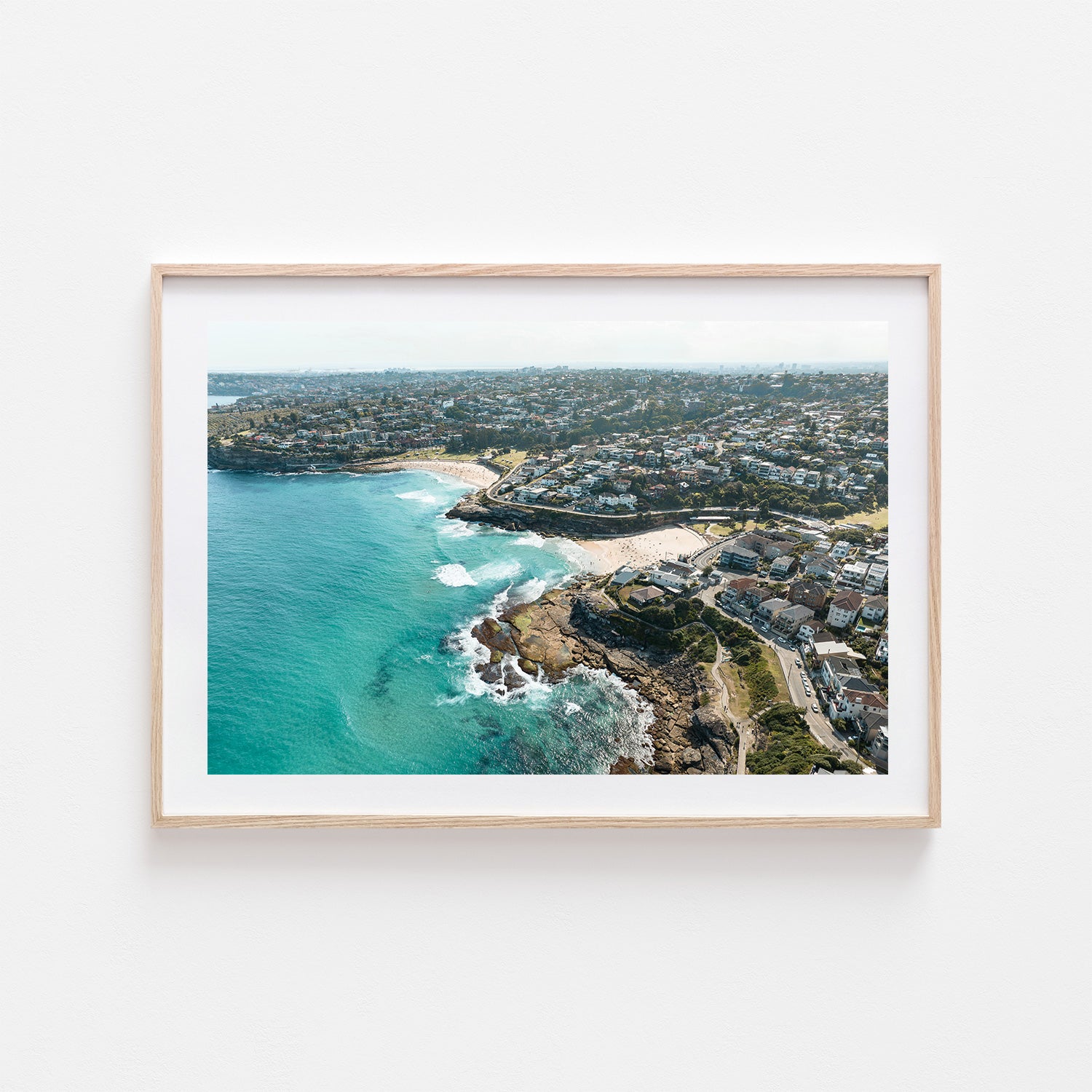 Tamarama neighbours swimming close together - coastal photography art print in oak frame