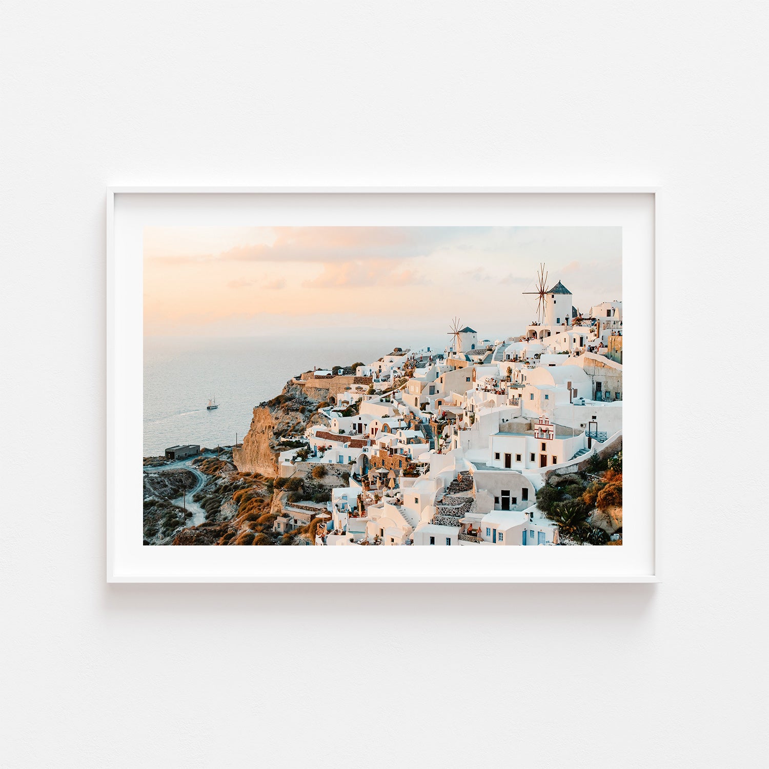 Santorini Oia village sunset seascape in white frame - Mediterranean coastal wall art