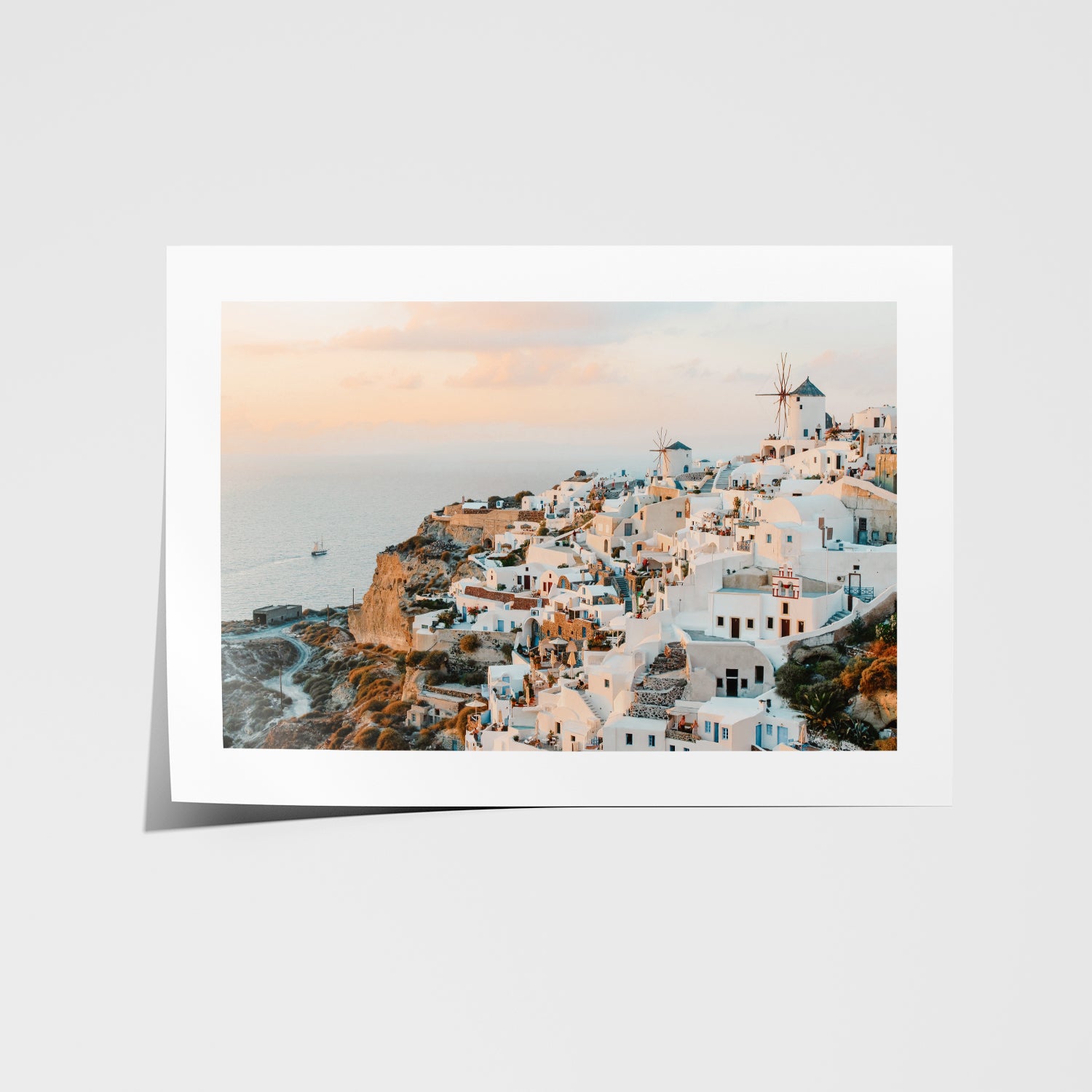 Santorini's Oia village sunset seascape in white frame - Mediterranean coastal wall art