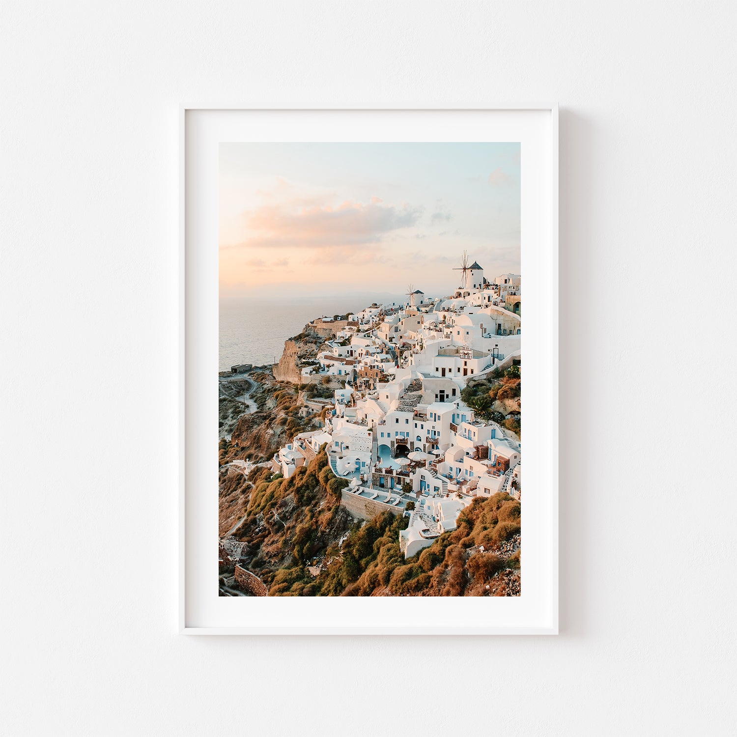 Santorini Oia village sunset seascape in white frame - Mediterranean coastal wall art