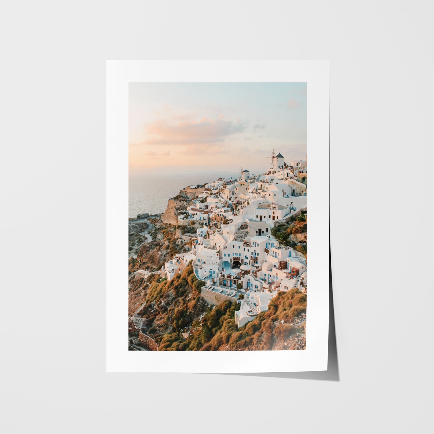 Santorini's Oia village sunset seascape in white frame - Mediterranean coastal wall art