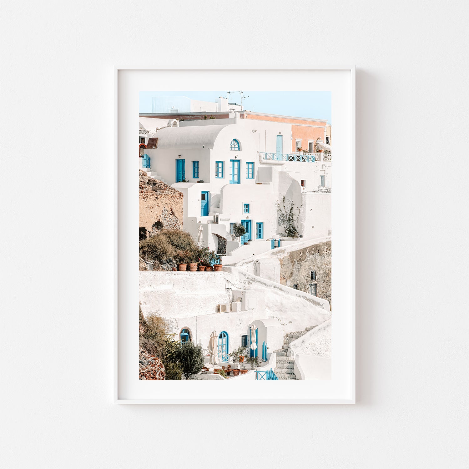 Oia Santorini whitewashed village landscape in white frame - Mediterranean coastal wall