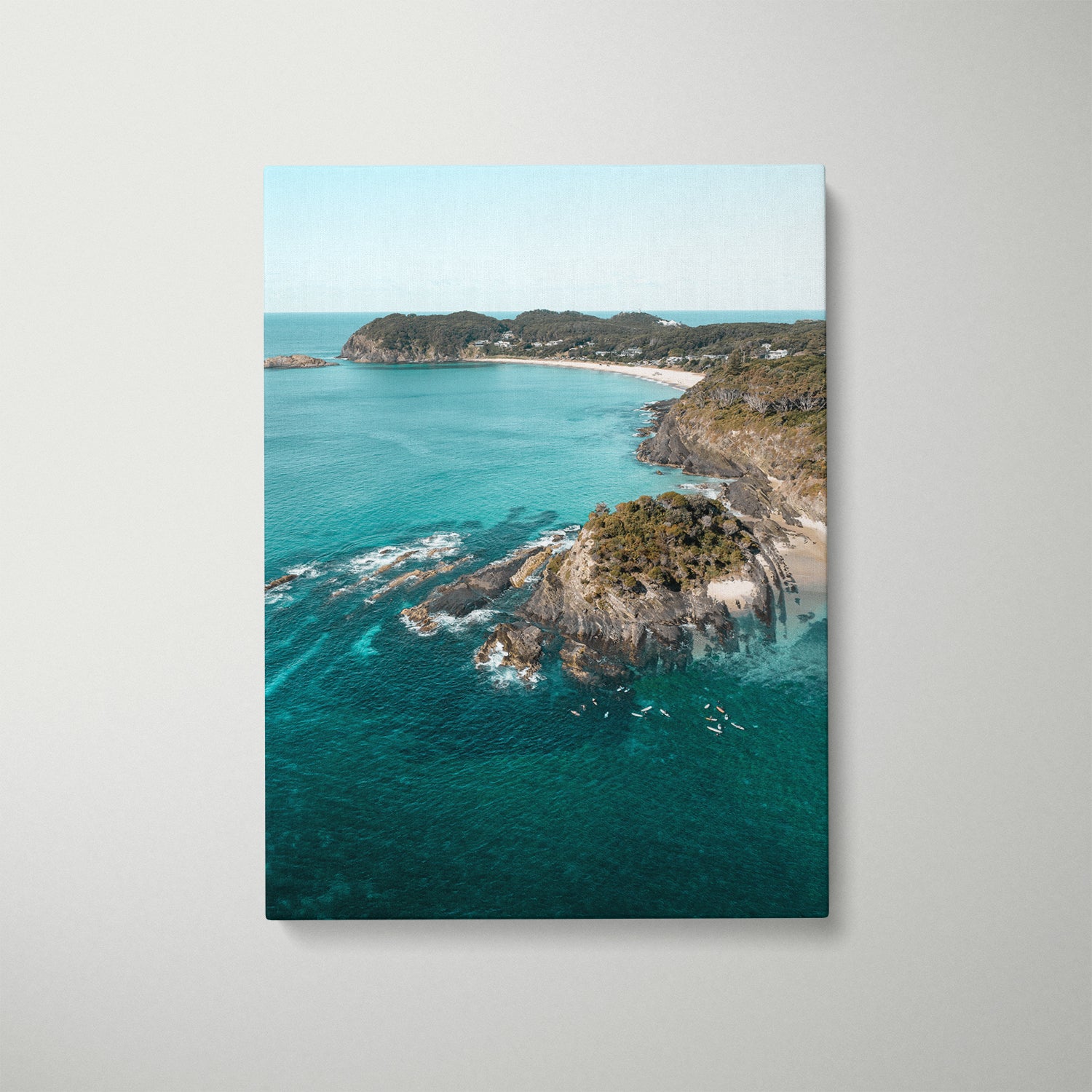 Sugarloaf Bay aerial view in white frame - coastal landscape wall art for modern homes