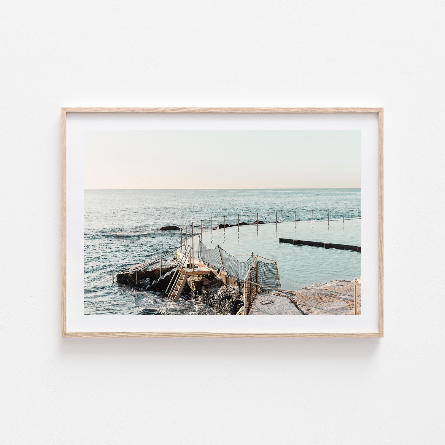 Bronte ocean sunrise scene in oak frame - sun kissed coastal photography wall art