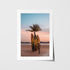 Tropical palm trees silhouetted at sunset in white frame - coastal landscape wall art