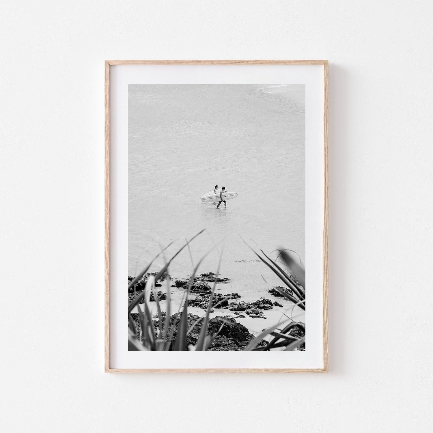 Byron Bay surf partners swimming - beach lifestyle photograph in oak frame