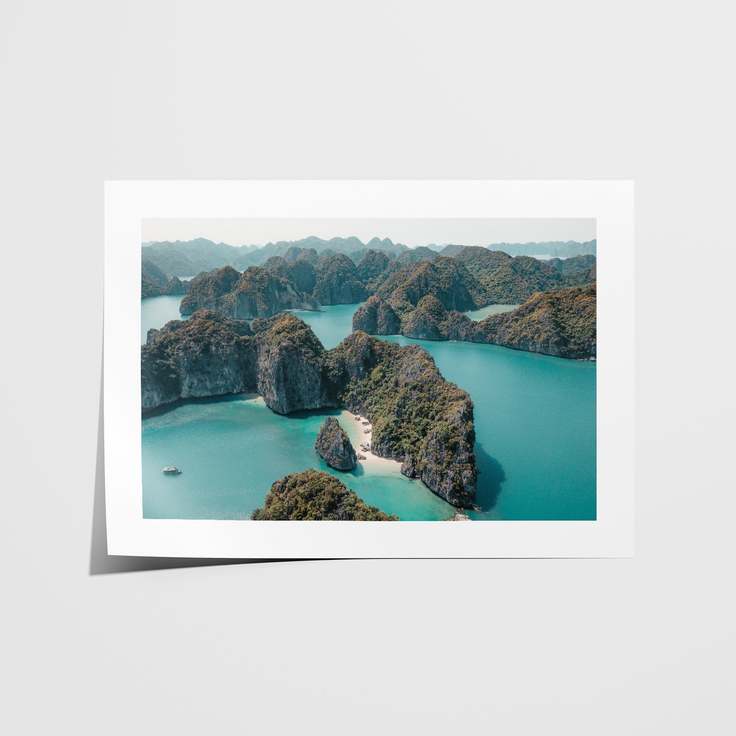 Ha Long Bay limestone islands aerial view in white frame - Vietnamese coastal landscape